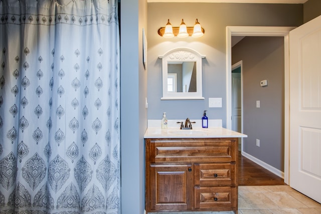 bathroom featuring vanity and tile floors