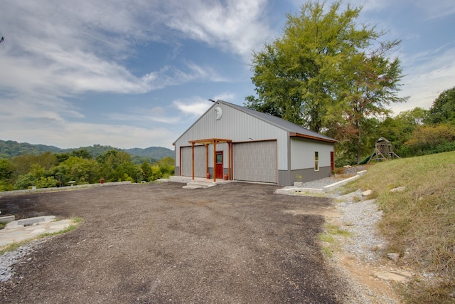 exterior space with an outdoor structure and a garage