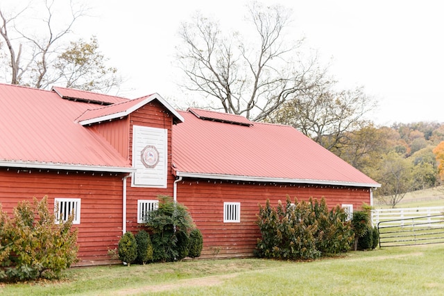 view of home's exterior featuring a lawn