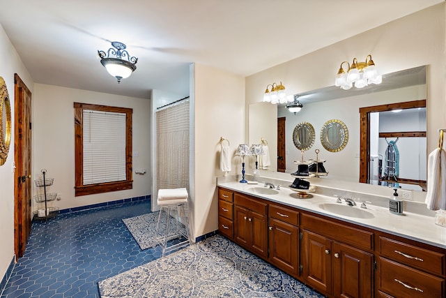 bathroom featuring tile floors and dual bowl vanity