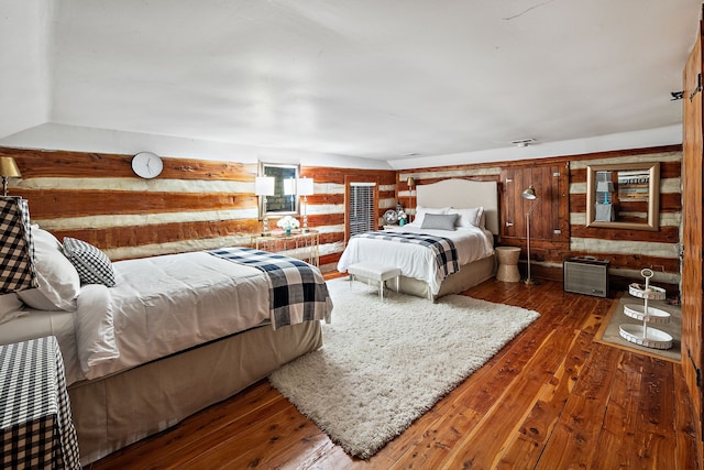 bedroom featuring dark hardwood / wood-style flooring