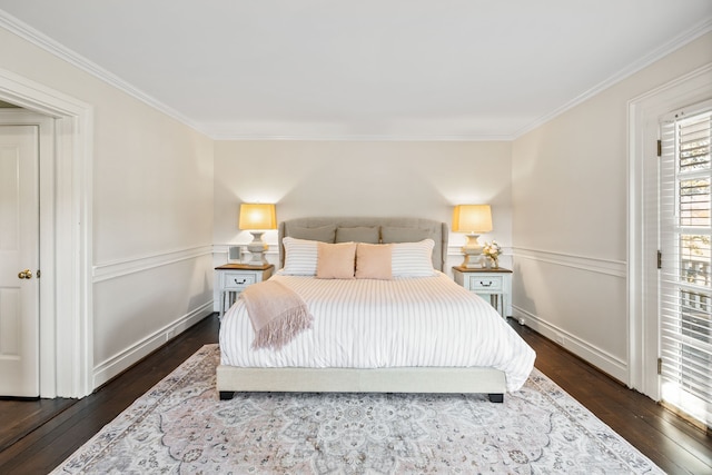 bedroom with dark hardwood / wood-style flooring and ornamental molding