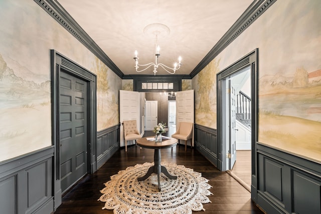 interior space featuring a chandelier, dark hardwood / wood-style floors, and crown molding