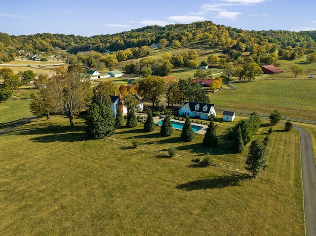 birds eye view of property with a rural view