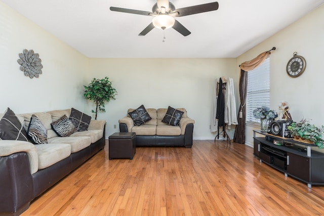 living room with light hardwood / wood-style floors and ceiling fan