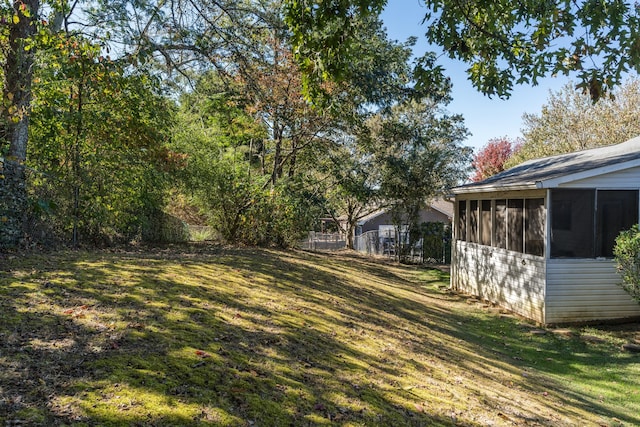 view of yard featuring a sunroom