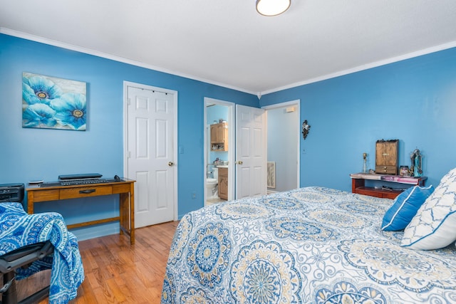 bedroom with ensuite bath, ornamental molding, and light hardwood / wood-style floors