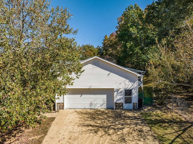 view of side of property featuring a garage