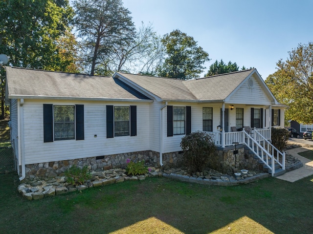 single story home with a front lawn and covered porch