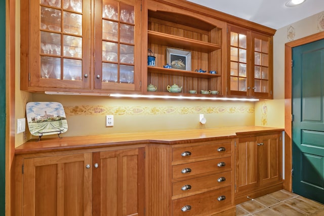 bar featuring light tile flooring