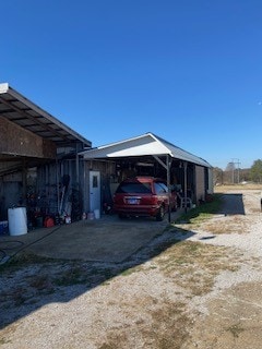 view of side of home featuring a carport