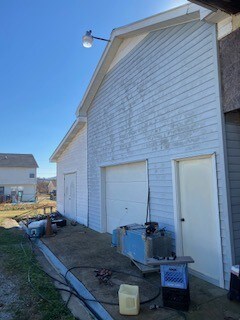 view of side of property featuring a garage