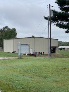 view of outdoor structure featuring a yard