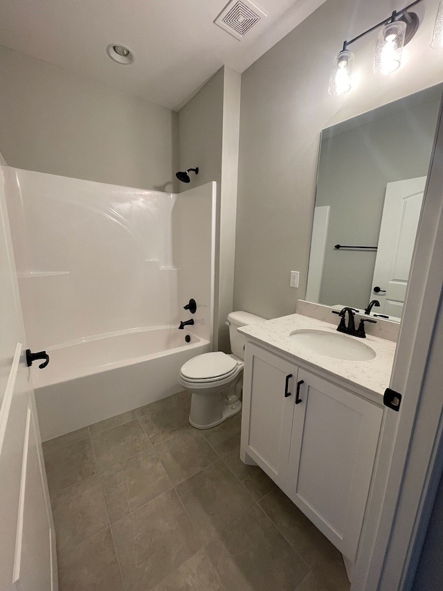 full bathroom with tile floors, toilet, oversized vanity, and shower / bath combination