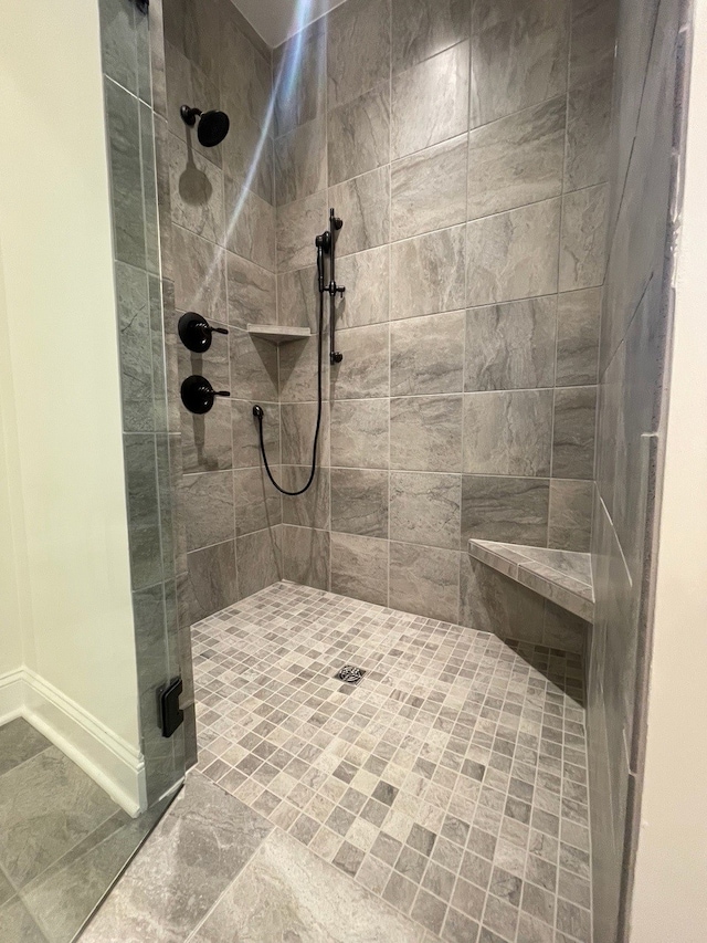 bathroom featuring tiled shower