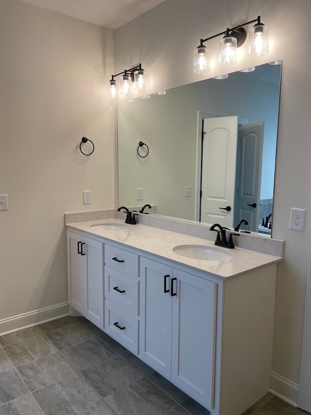 bathroom featuring double sink, tile floors, and oversized vanity