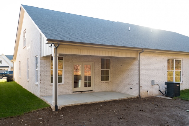 rear view of house featuring a patio and central AC unit