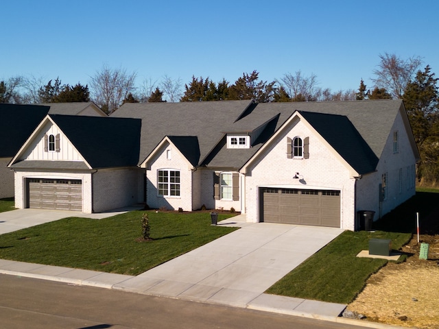 view of front of property featuring a front lawn and a garage