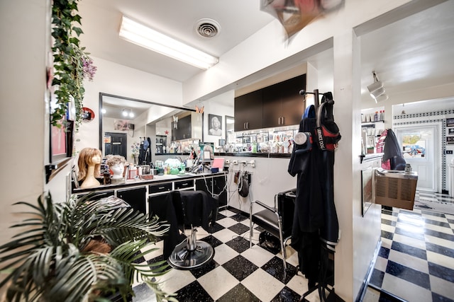 interior space featuring light tile floors and kitchen peninsula