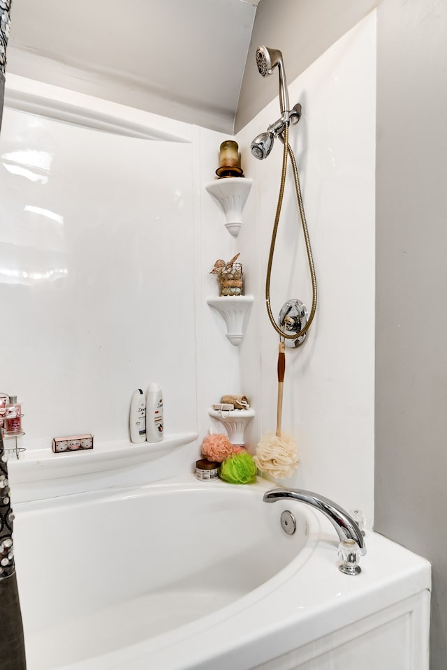 bathroom featuring vaulted ceiling