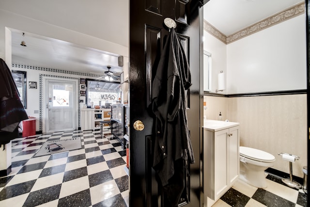 bathroom featuring vanity, tile flooring, ceiling fan, and toilet