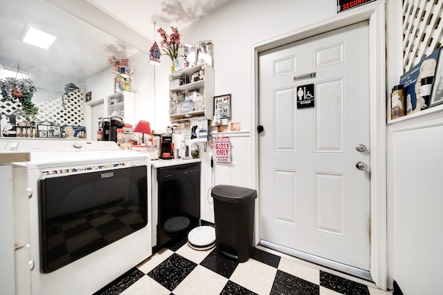 interior space featuring light tile floors and washer and clothes dryer