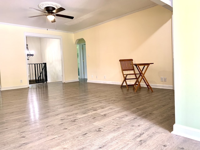 interior space featuring crown molding, hardwood / wood-style floors, and ceiling fan