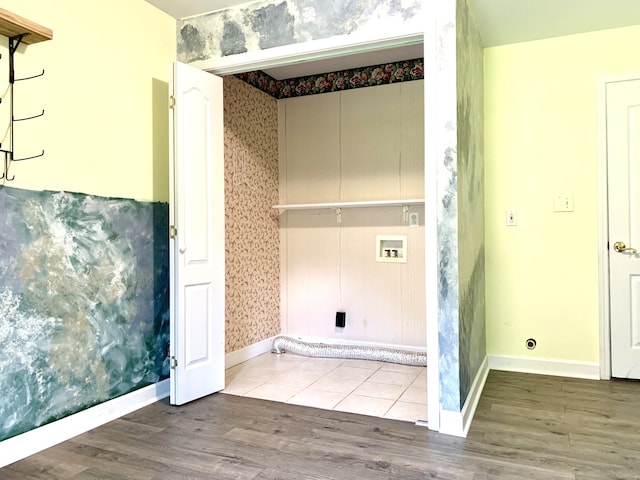 washroom with hardwood / wood-style floors and washer hookup