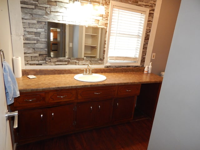 bathroom with vanity and hardwood / wood-style flooring