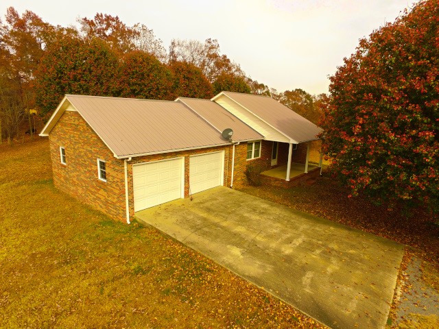 garage with a lawn