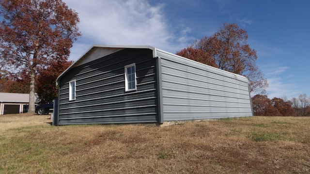 view of outdoor structure with a lawn