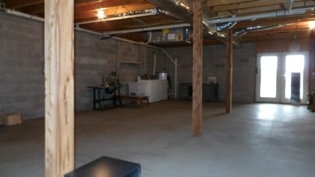 basement with washer and clothes dryer