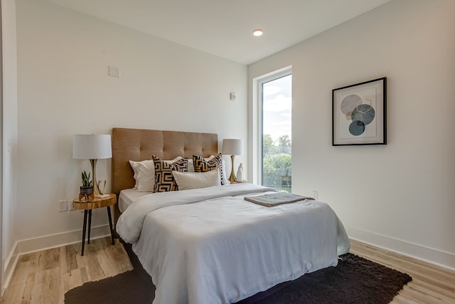 bedroom with light hardwood / wood-style floors