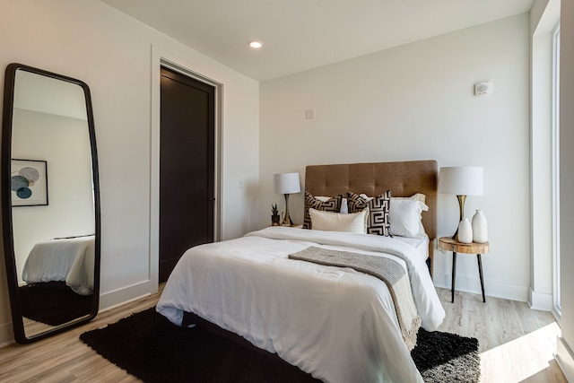 bedroom featuring light hardwood / wood-style flooring