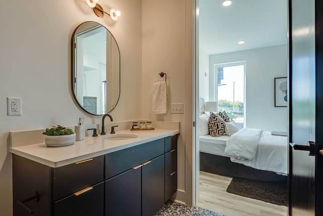 bathroom featuring wood-type flooring and vanity