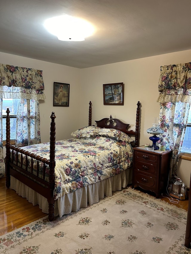 bedroom with light wood-type flooring