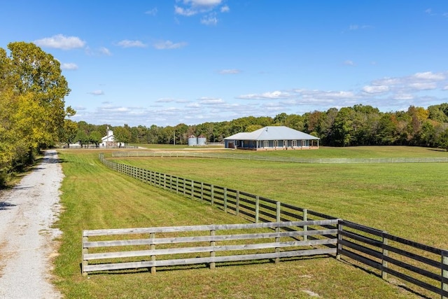 view of yard with a rural view