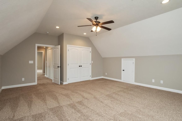 bonus room with ceiling fan, carpet floors, and lofted ceiling