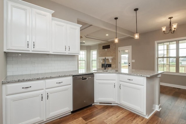 kitchen featuring stainless steel dishwasher, sink, a chandelier, white cabinets, and light hardwood / wood-style floors