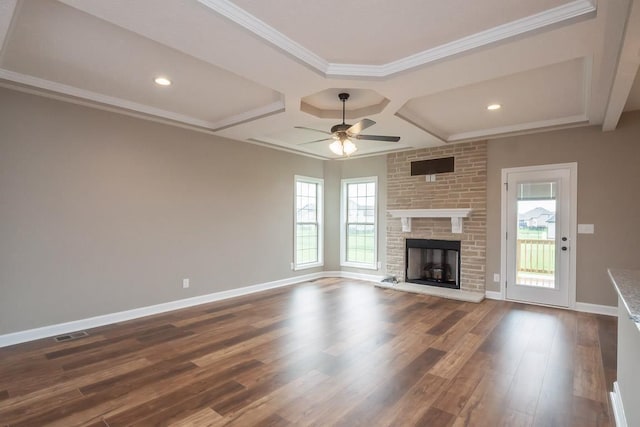 unfurnished living room featuring dark hardwood / wood-style flooring, plenty of natural light, ornamental molding, and ceiling fan