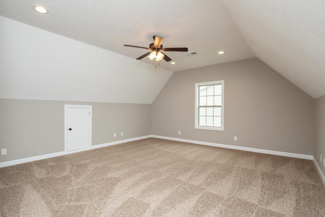 bonus room with ceiling fan, carpet, and vaulted ceiling