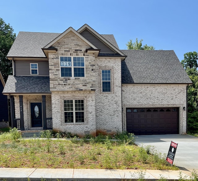 view of front of home with a garage