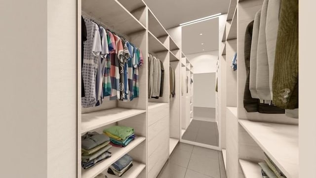 spacious closet featuring light tile patterned floors