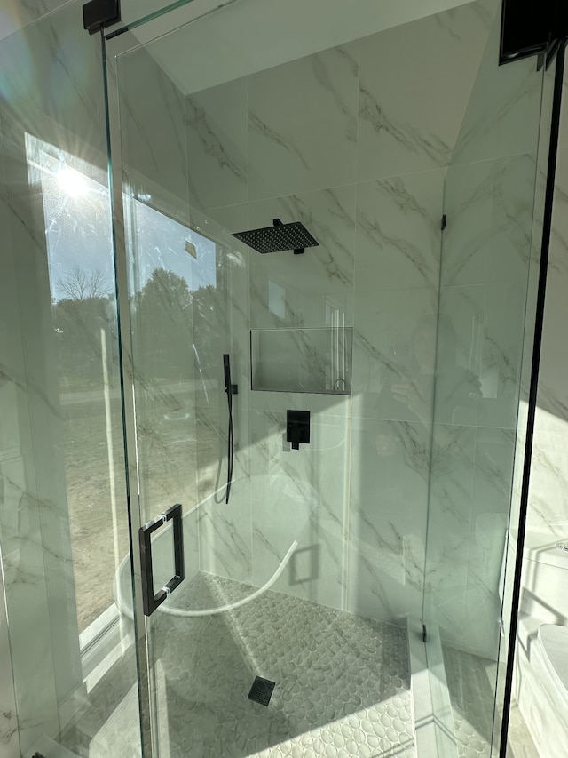 bathroom featuring an enclosed shower