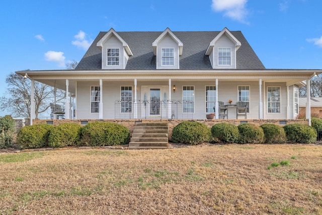 view of front of house with a front yard and a porch