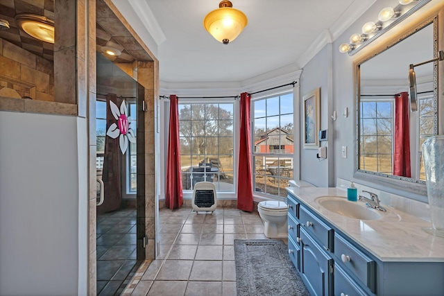 bathroom featuring ornamental molding, toilet, tile patterned floors, and vanity