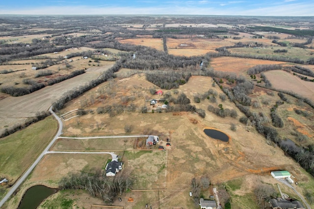 birds eye view of property with a rural view