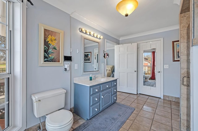 bathroom with crown molding, vanity, and toilet