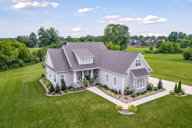 view of front of property with a porch and a front lawn