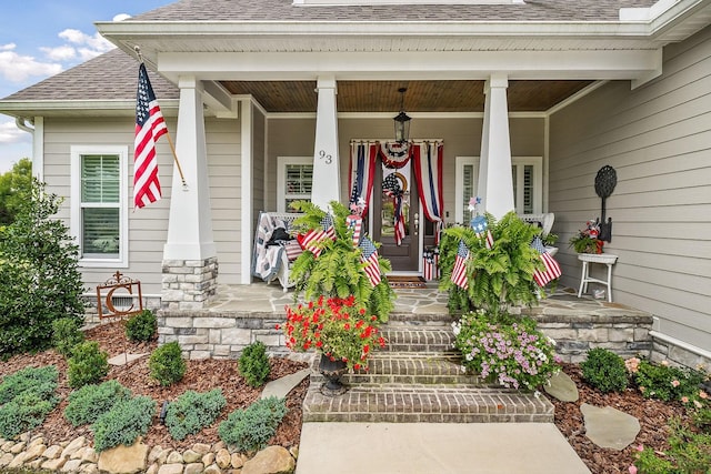 doorway to property featuring covered porch